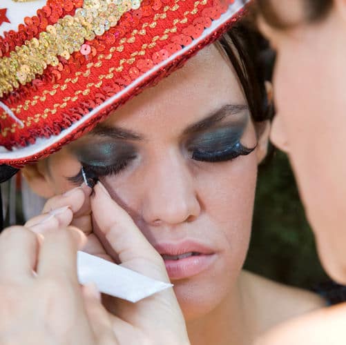 applying false makeup lashes